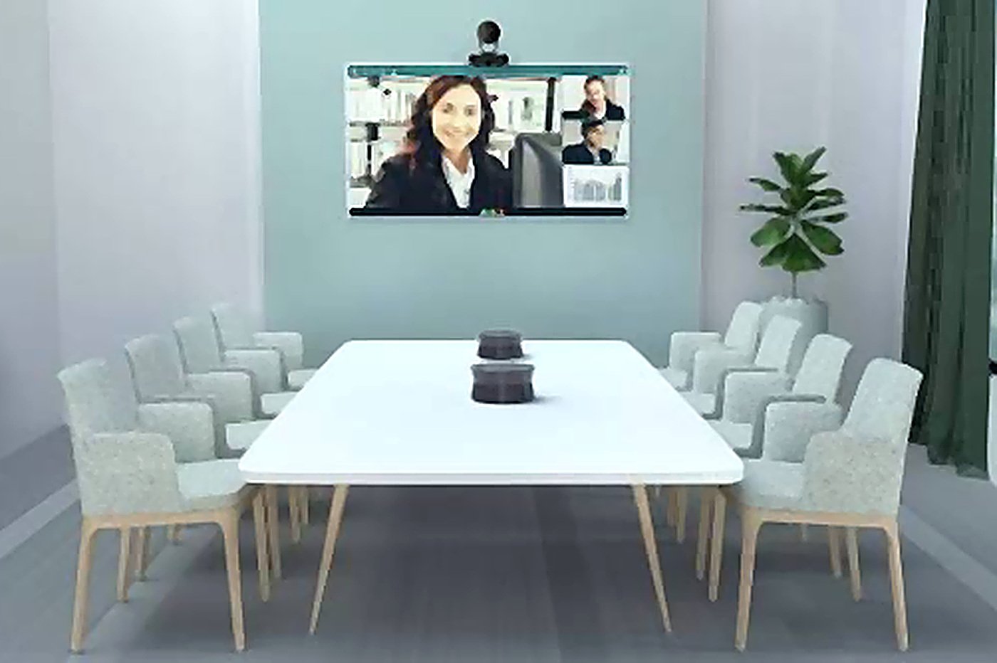 A medium meeting room with a front-of-room video bar and display
