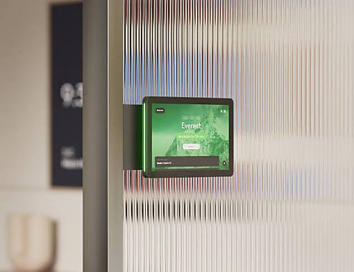 A wall-mounted panel showing live room occupancy status