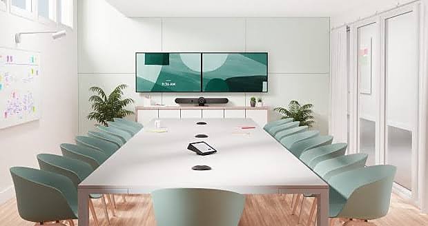 A digital collaboration room with dual displays and table controller